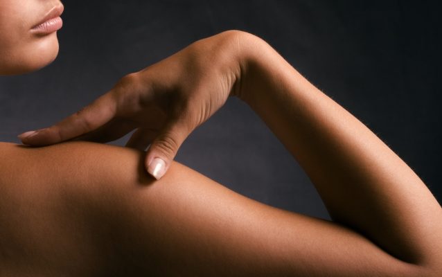 Tanned Body Of A Beautiful Young Woman.