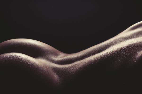 Sensual High Contrast View Of Nude Wet Female Back